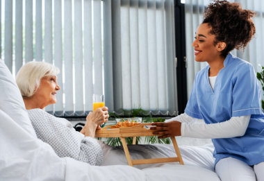 Caregiver giving food