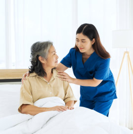 Caregiver talking to elderly