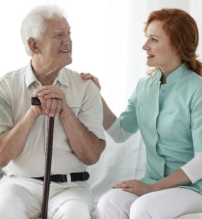 senior man talking with young woman