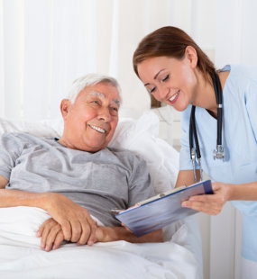 caregiver and senior smiling