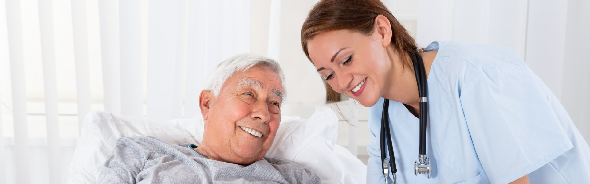 caregiver and senior smiling